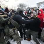 Dice manifestantes Minnesota son profesionales bien pagados